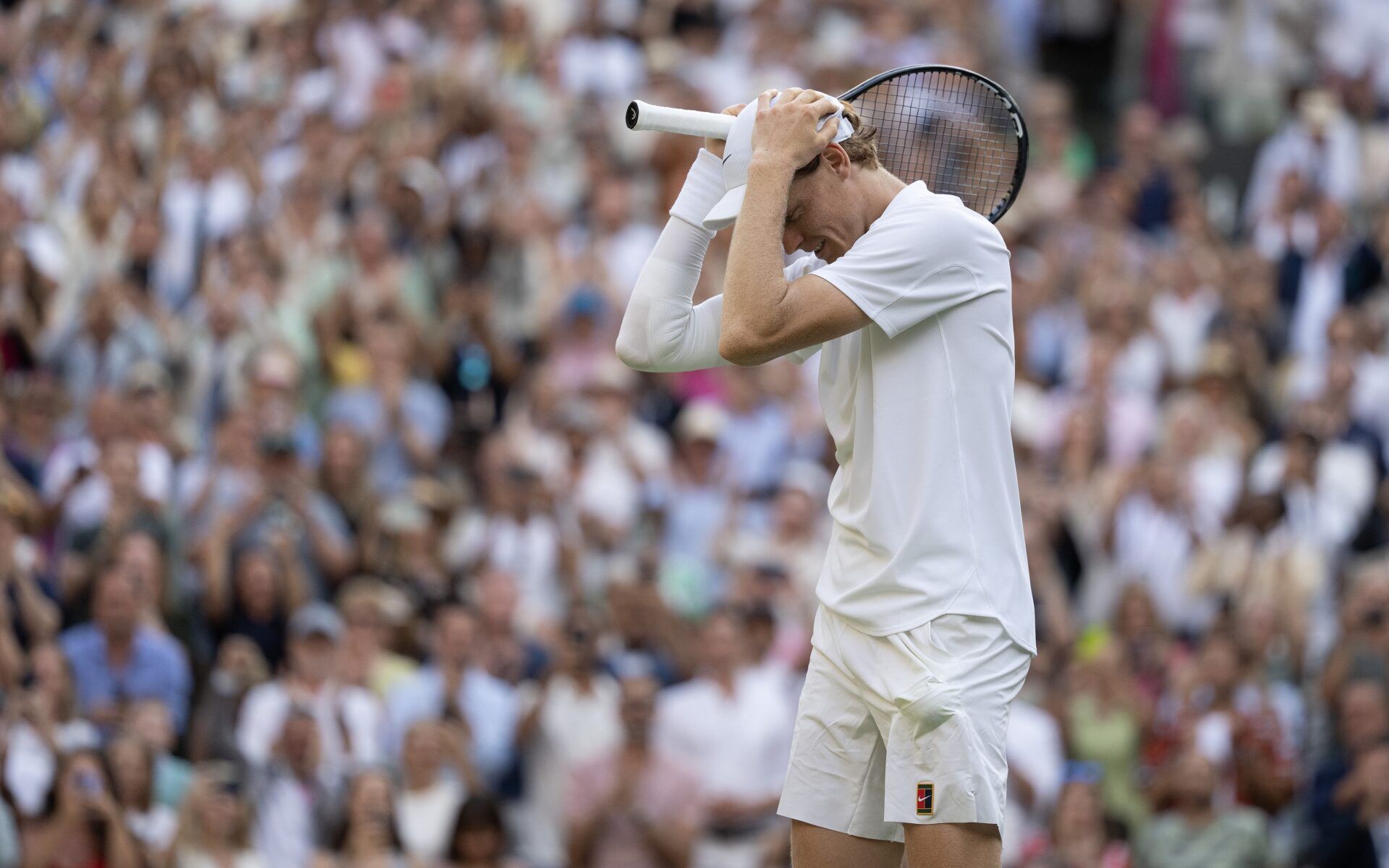 Jannik Sinner of Italy celebrates winning the menÕs singles final match against Carlos Alcaraz of Spain on day 14 at All England Lawn Tennis and Croquet Club.