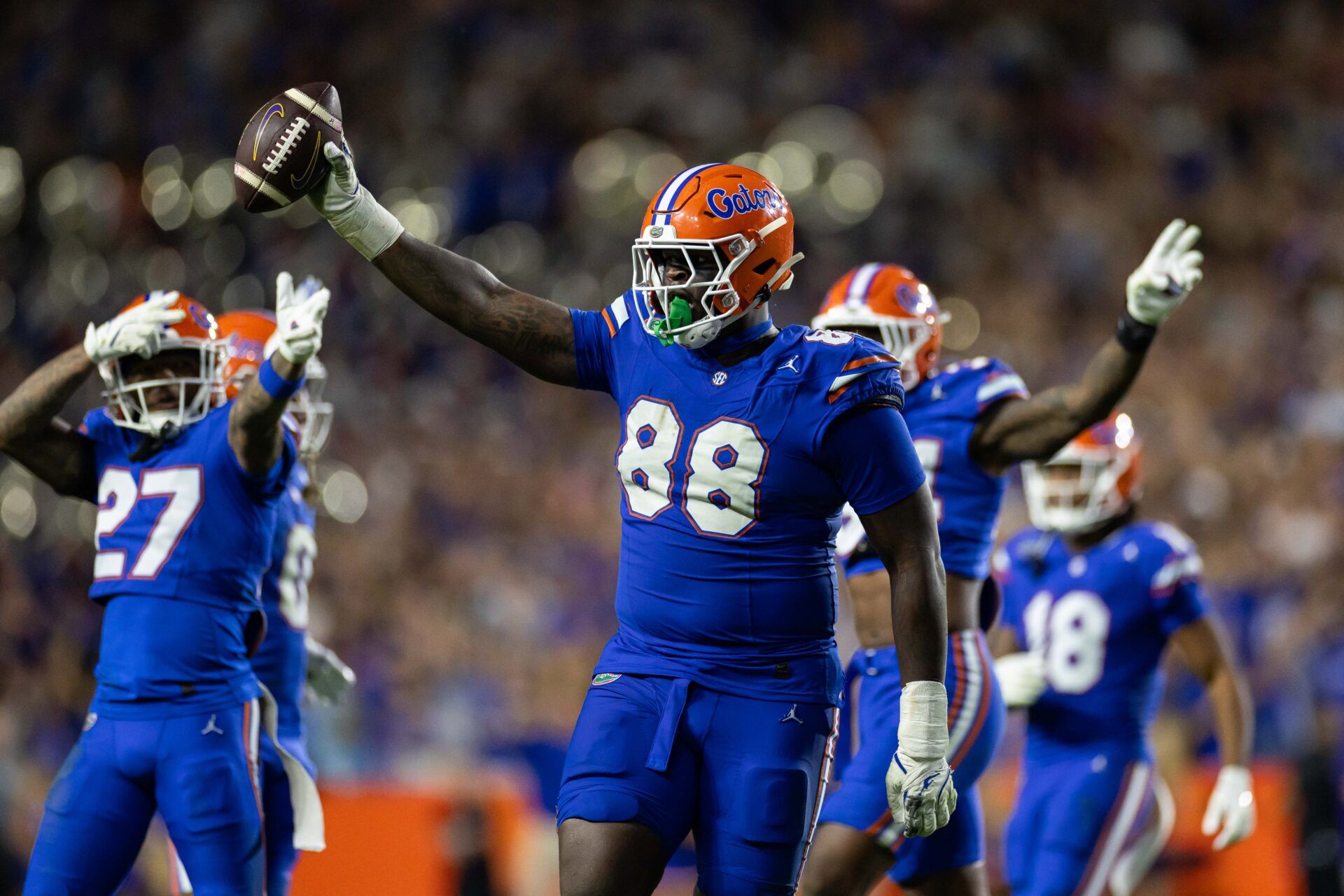 Florida Gators defensive lineman Caleb Banks (88) celebrates with the ball after a fumble recovery against the LSU Tigers during the second half at Ben Hill Griffin Stadium.