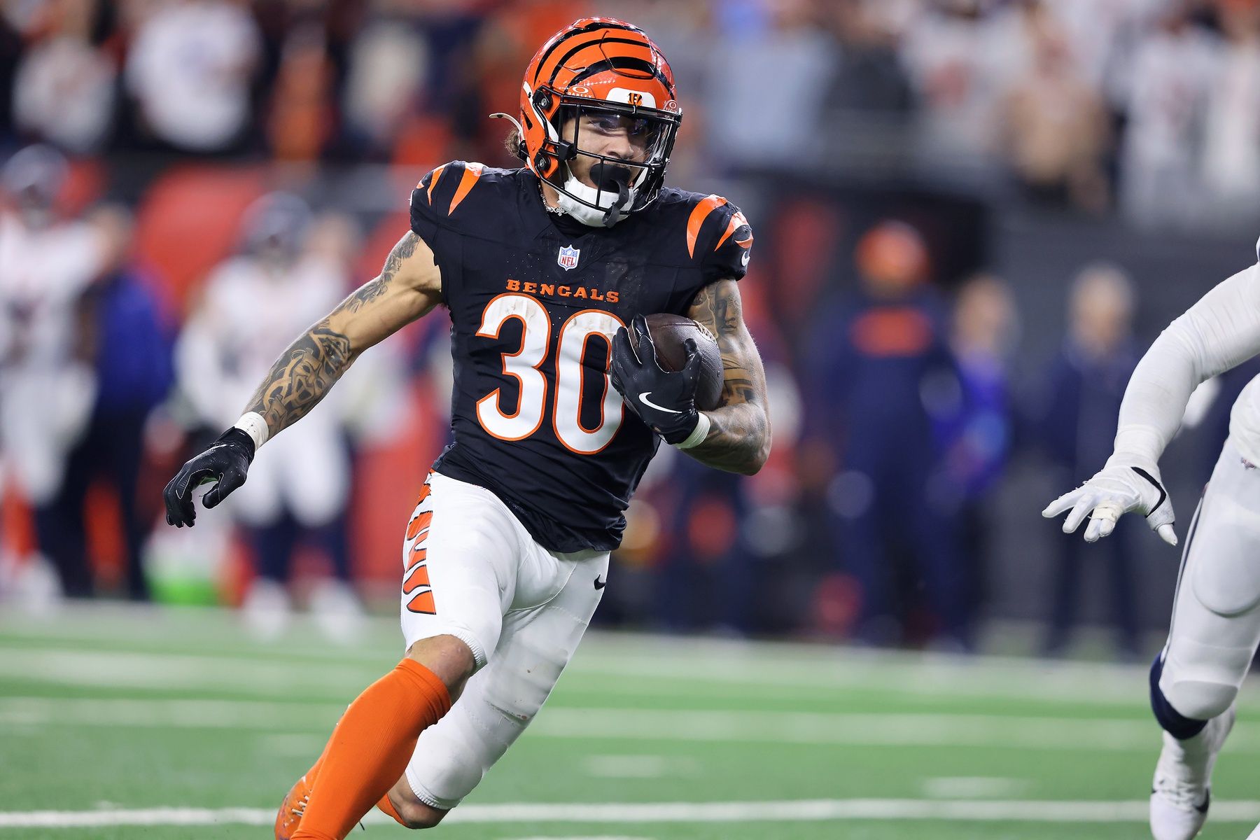 Cincinnati Bengals running back Chase Brown (30) runs the ball during the fourth quarter against the Denver Broncos at Paycor Stadium.