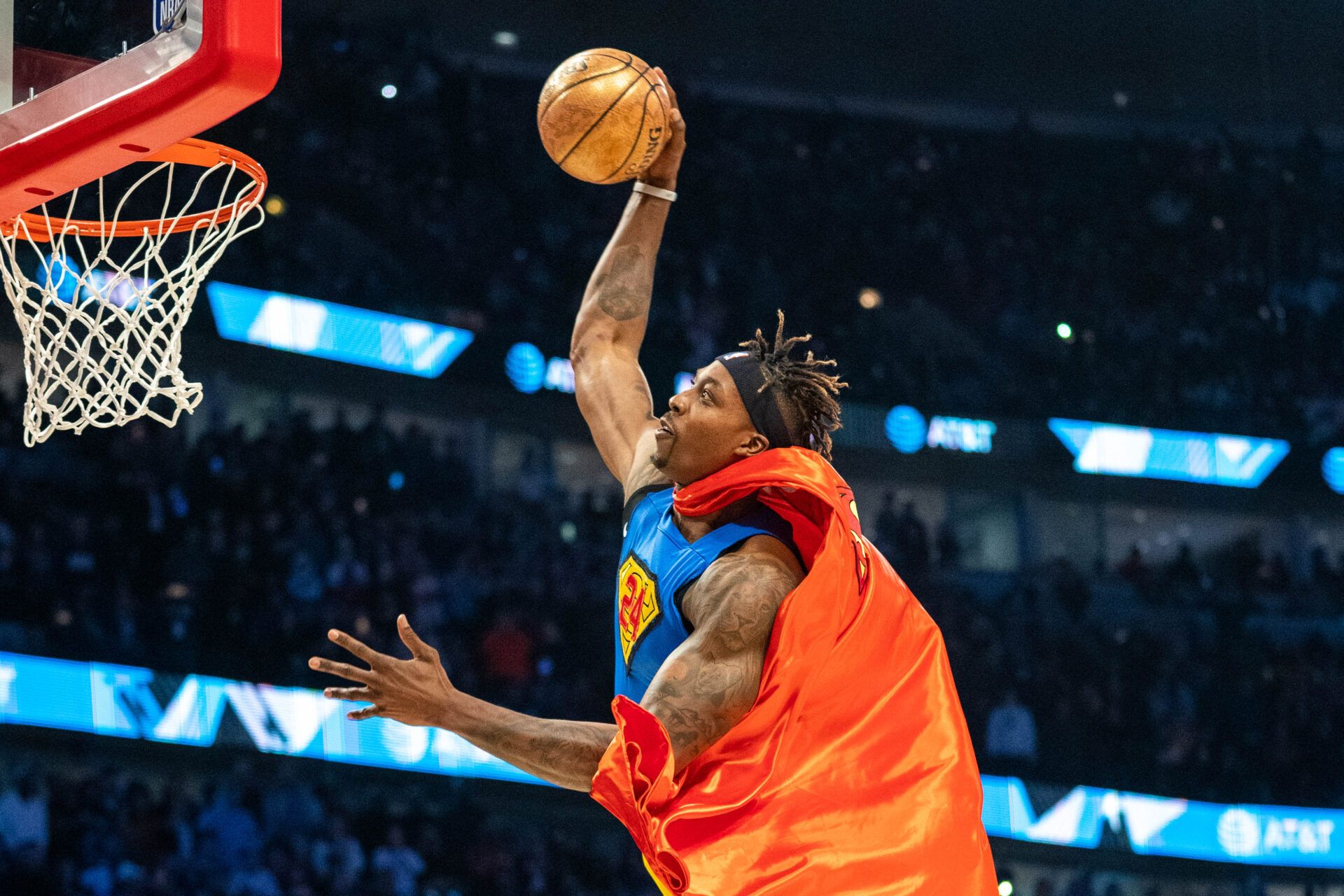 Los Angeles Lakers player Dwight Howard dunks in a Superman costume dedicated to the late Los Angeles Lakers great Kobe Bryant during NBA All Star Saturday Night at United Center.