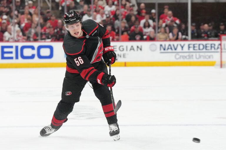 Carolina Hurricanes defenseman Scott Morrow (56) passes the puck during the first period against the Florida Panthers in game two of the Eastern Conference Final of the 2025 Stanley Cup Playoffs at Lenovo Center.