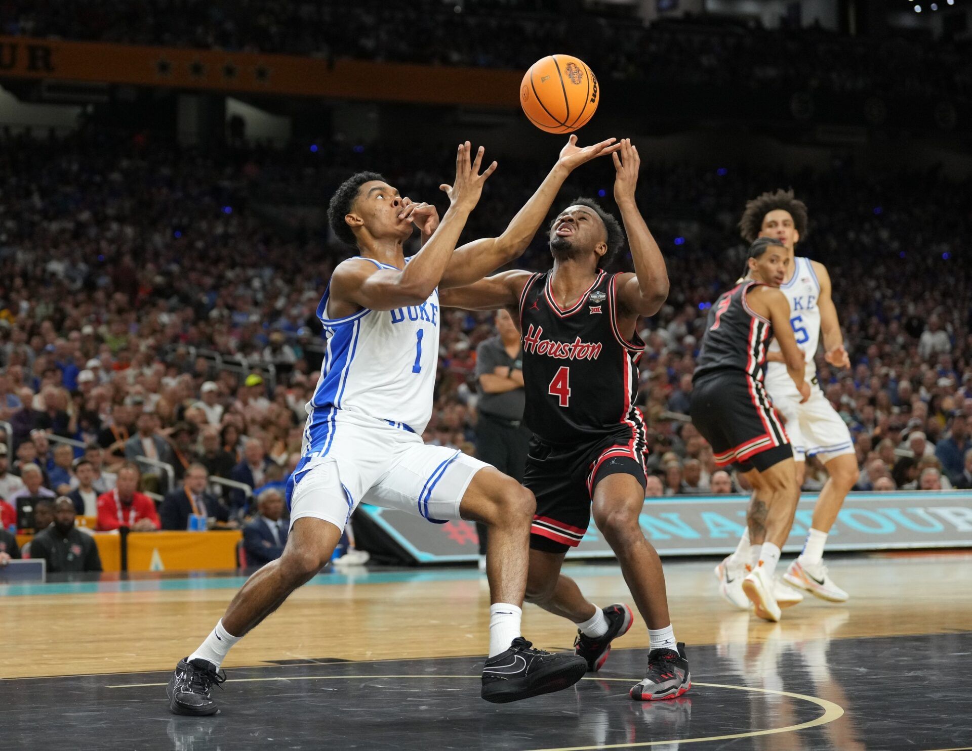 Duke Blue Devils guard Caleb Foster (1) and Houston Cougars guard L.J. Cryer (4) battles for the ball in the semifinals of the men's Final Four of the 2025 NCAA Tournament at the Alamodome.
