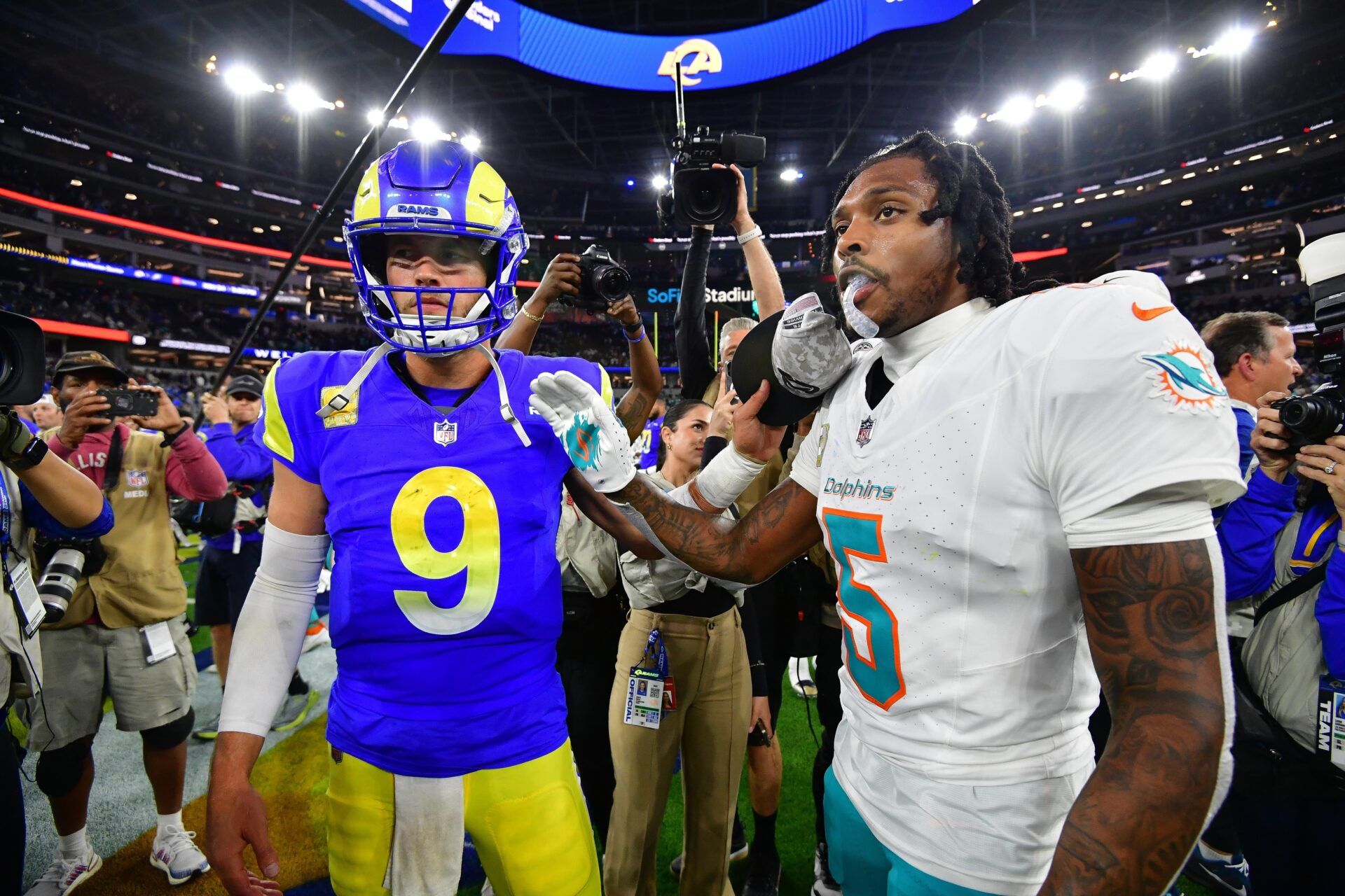 Los Angeles Rams quarterback Matthew Stafford (9) meets with Miami Dolphins cornerback Jalen Ramsey (5) following the game at SoFi Stadium.