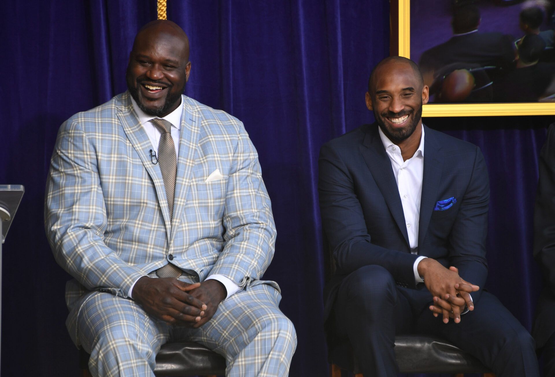 Los Angeles Lakers former center Shaquille O'Neal (left) and guard Kobe Bryant react during ceremony to unveil statue of O'Neal at Staples Center.