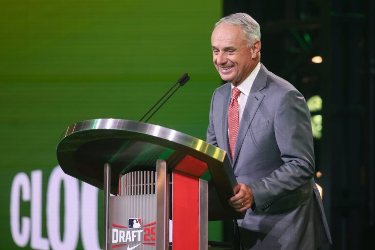MLB Commissioner Rob Manfred announces the pick for the Athletics pick during the MLB Draft at The Coca-Cola Roxy.