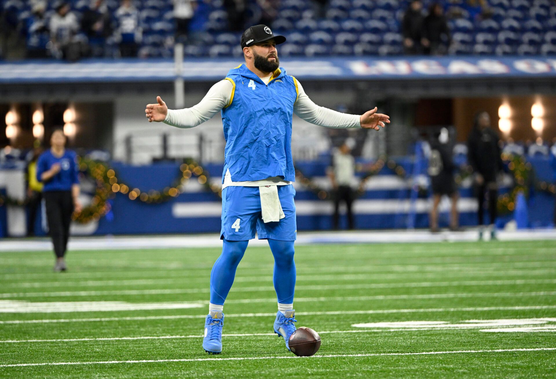 Los Angeles Chargers quarterback Chase Daniel (4) warms up before the game against the Indianapolis Colts at Lucas Oil Stadium.