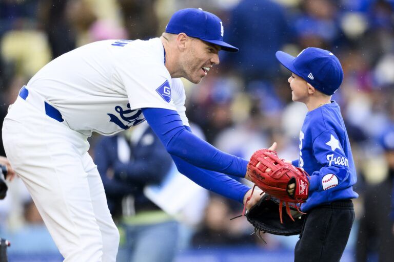 Charlie Freeman, the son of Los Angeles Dodgers first baseman Freddie Freeman, reacts after throwing out the first pitch between the Los Angeles Dodgers and St. Louis Cardinals at Dodger Stadium.