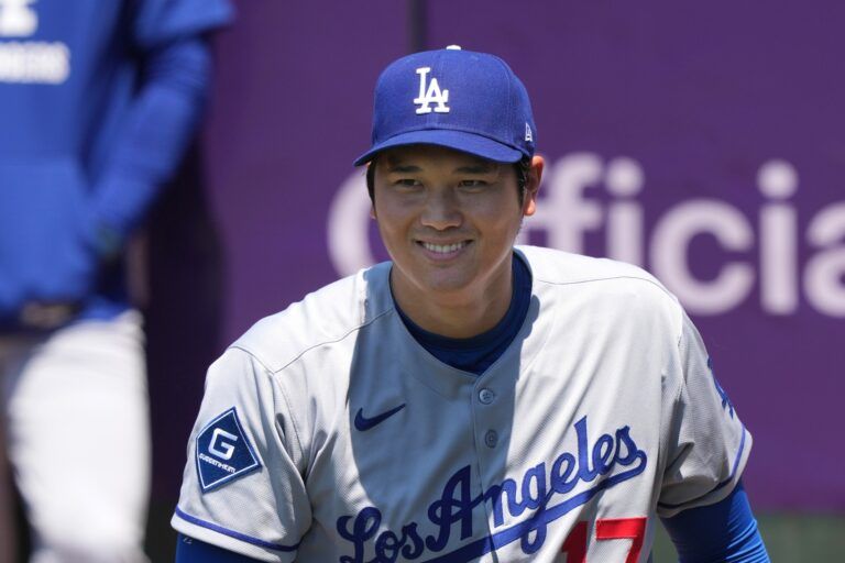 Los Angeles Dodgers starting pitcher Shohei Ohtani (17) smiles in the bullpen before the game against the San Francisco Giants at Oracle Park.