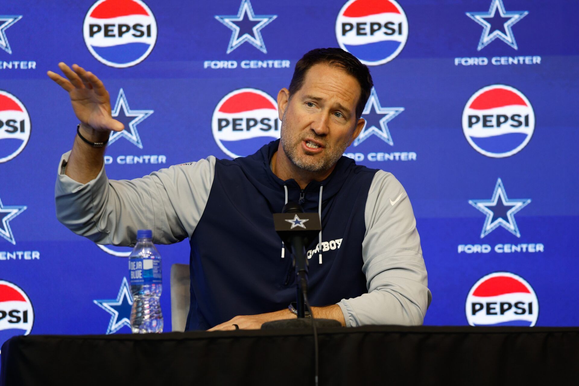 Dallas Cowboys head coach Brian Schottenheimer addresses the media before practice at the Ford Center at the Star Training Facility in Frisco, Texas.
