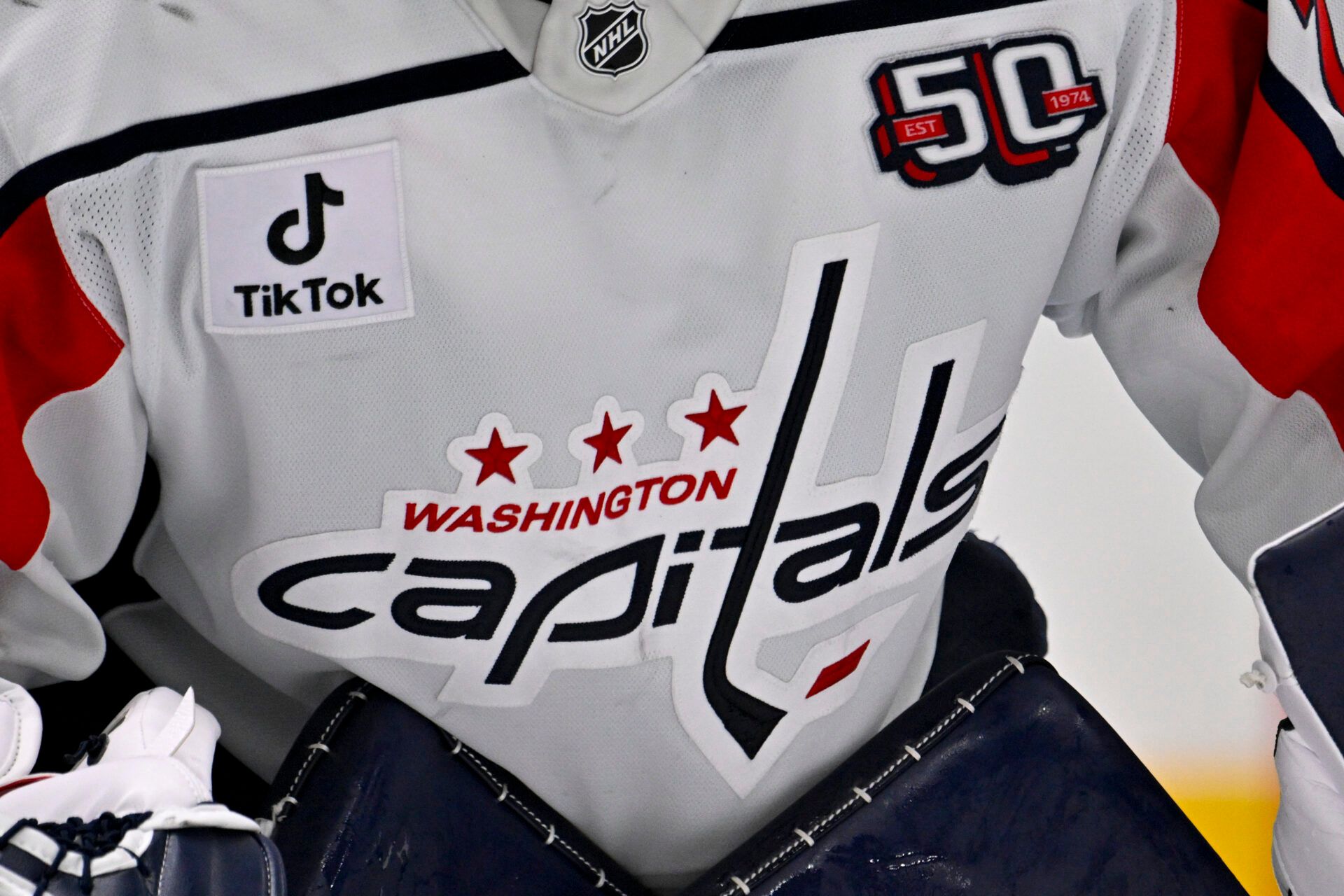 A view of the Capitals logo on the jersey of Washington Capitals goaltender Charlie Lindgren (79) during the game between the Dallas Stars and the Washington Capitals at American Airlines Center.