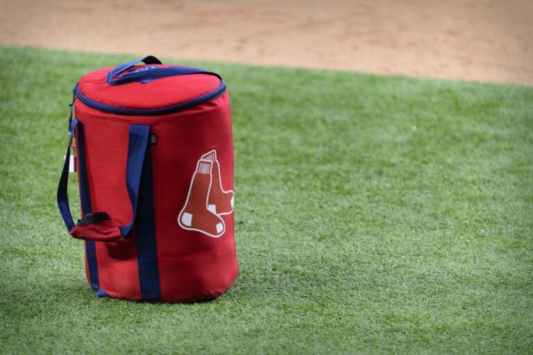 A view of the Boston Red Sox logo and a field bag during batting practice before the game between the Texas Rangers and the Boston Red Sox at Globe Life Field.