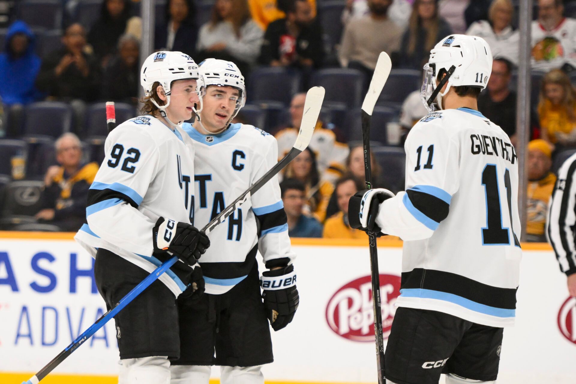 Utah Hockey Club center Logan Cooley (92) celebrates a goal with his teammates against the Nashville Predators during the second period at Bridgestone Arena.