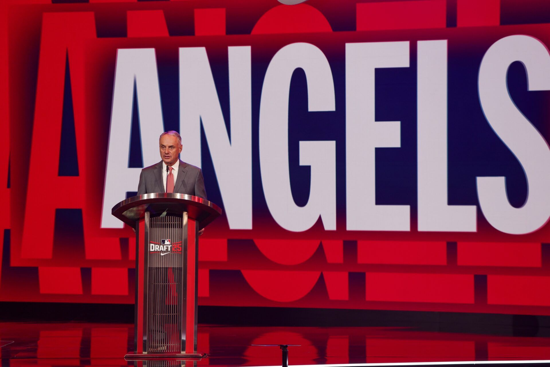 MLB Commissioner Rob Manfred announces the Los Angeles Angels pick during the MLB Draft at The Coca-Cola Roxy.