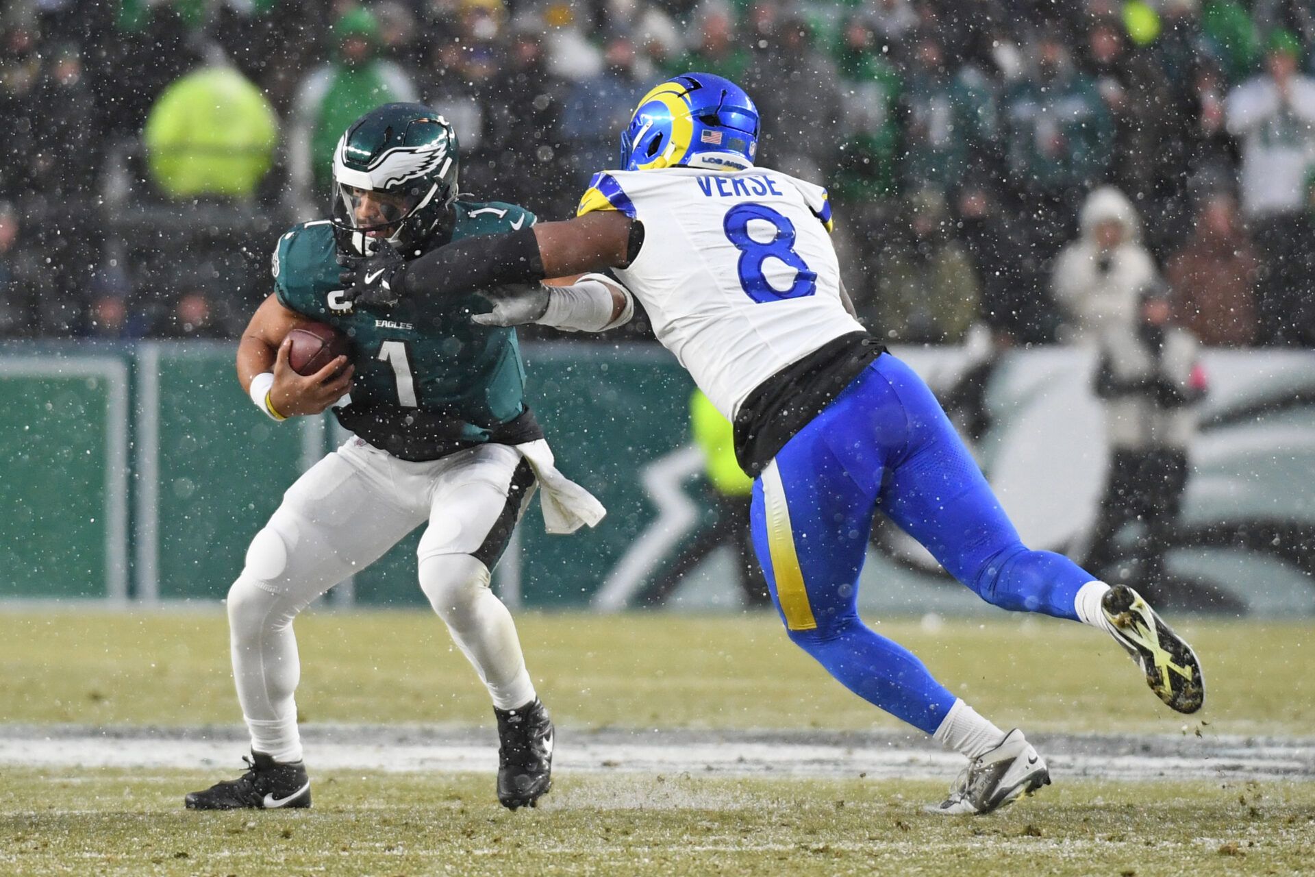 Los Angeles Rams linebacker Jared Verse (8) sacks Philadelphia Eagles quarterback Jalen Hurts (1) in a 2025 NFC divisional round game at Lincoln Financial Field.