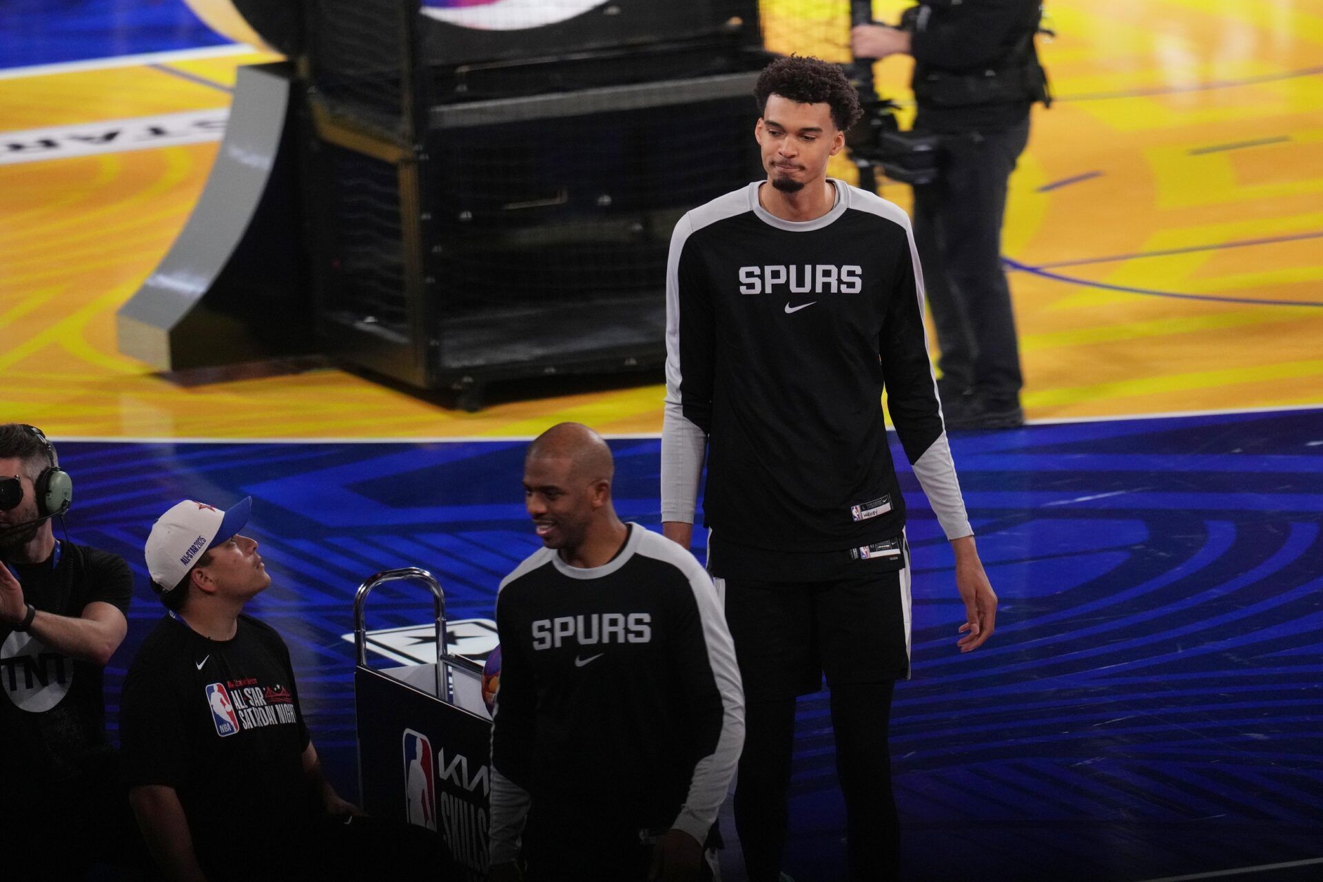 Team Spurs guard Chris Paul (3) and Team Spurs center Victor Wembanyama (1) of the San Antonio Spurs react after competing in the skills challenge during All Star Saturday Night ahead of the 2025 NBA All Star Game at Chase Center.