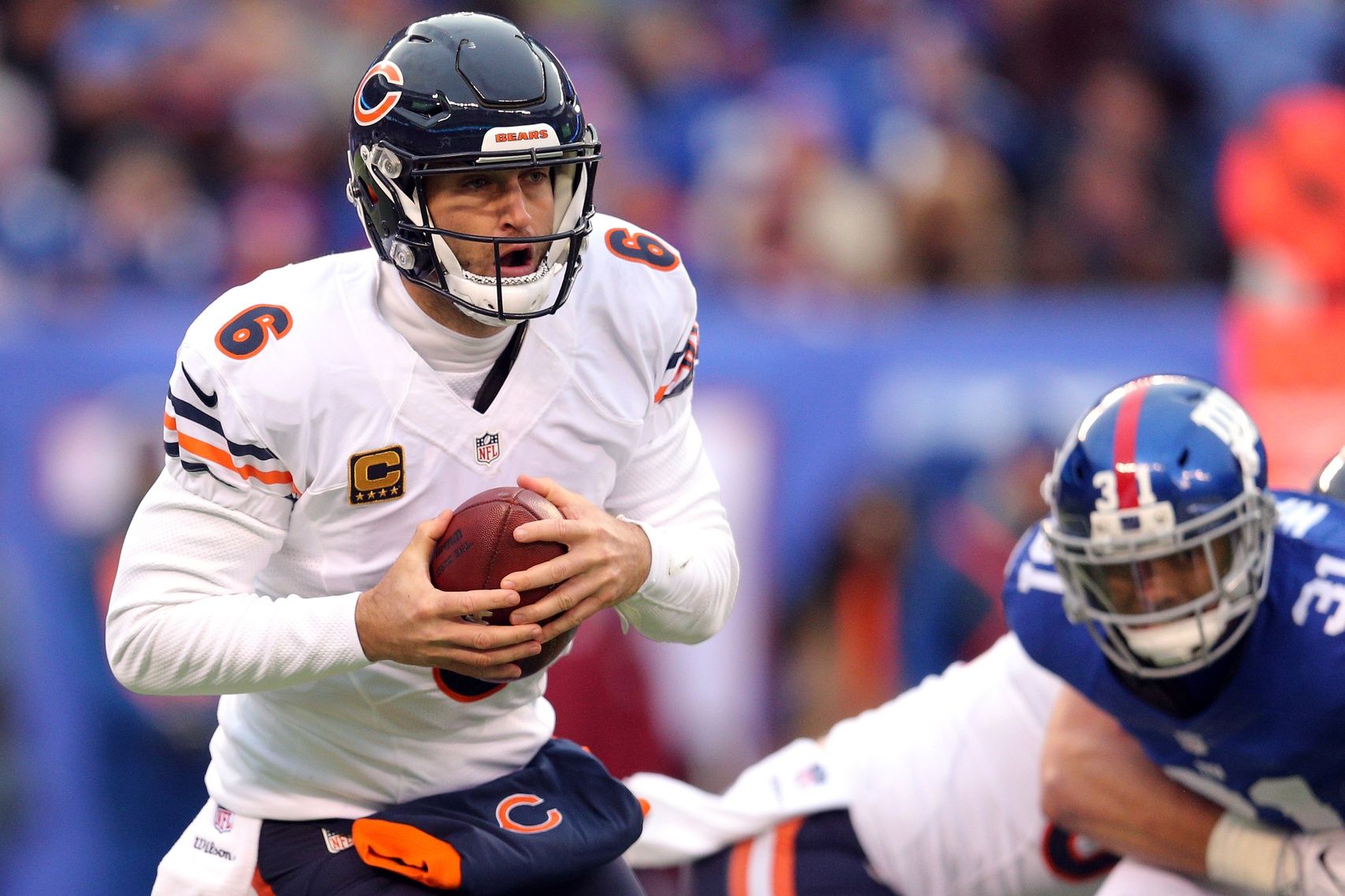Chicago Bears quarterback Jay Cutler (6) runs with the ball against the New York Giants during the third quarter at MetLife Stadium.