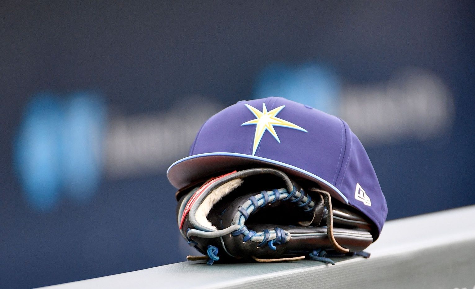 A general view of a Tampa Bay Rays hat and glove on the dugout fence before the game against the Kansas City Royals at Kauffman Stadium.