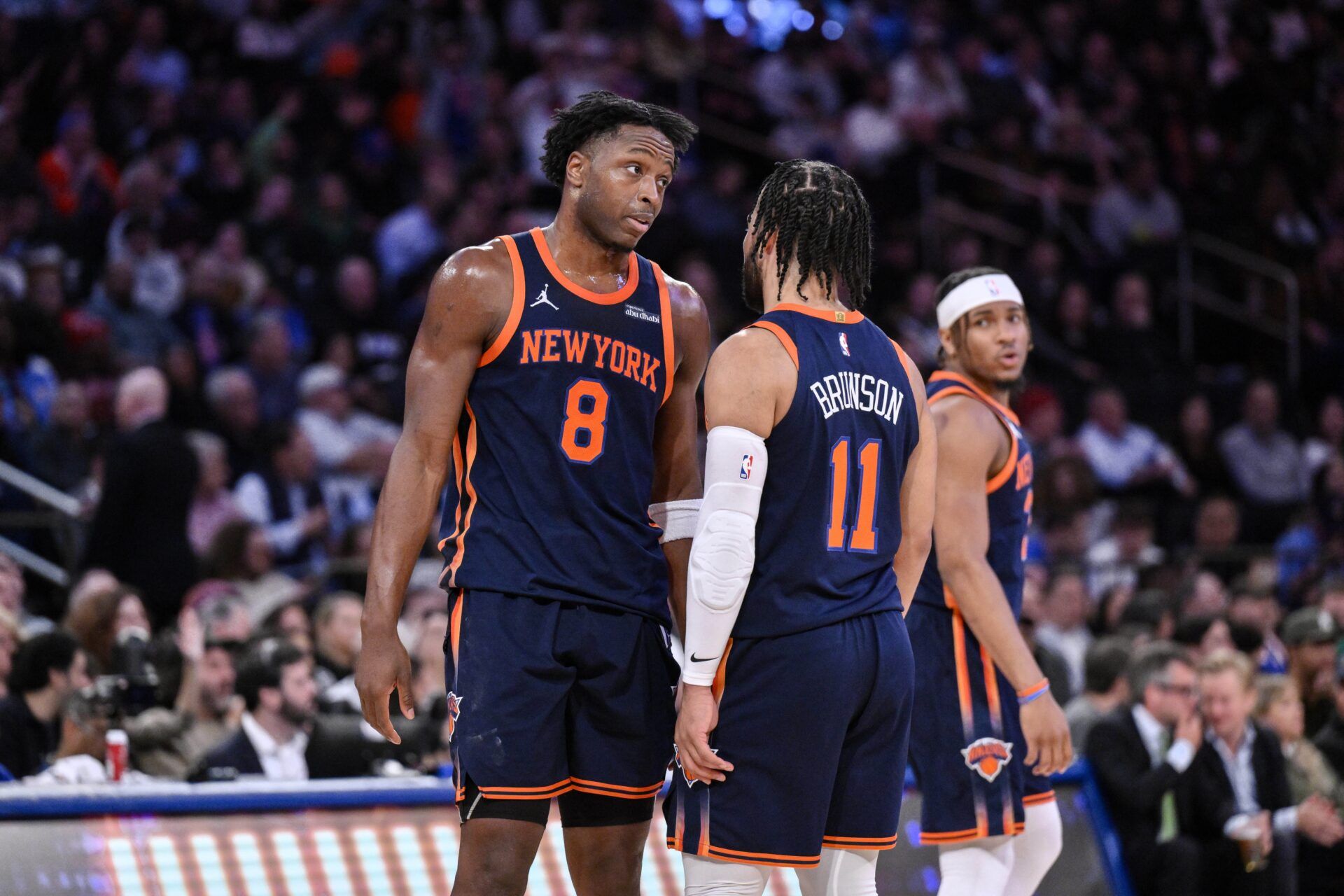 New York Knicks forward OG Anunoby (8) and guard Jalen Brunson (11) chat during a break in the action in the second half against the Boston Celtics at Madison Square Garden.