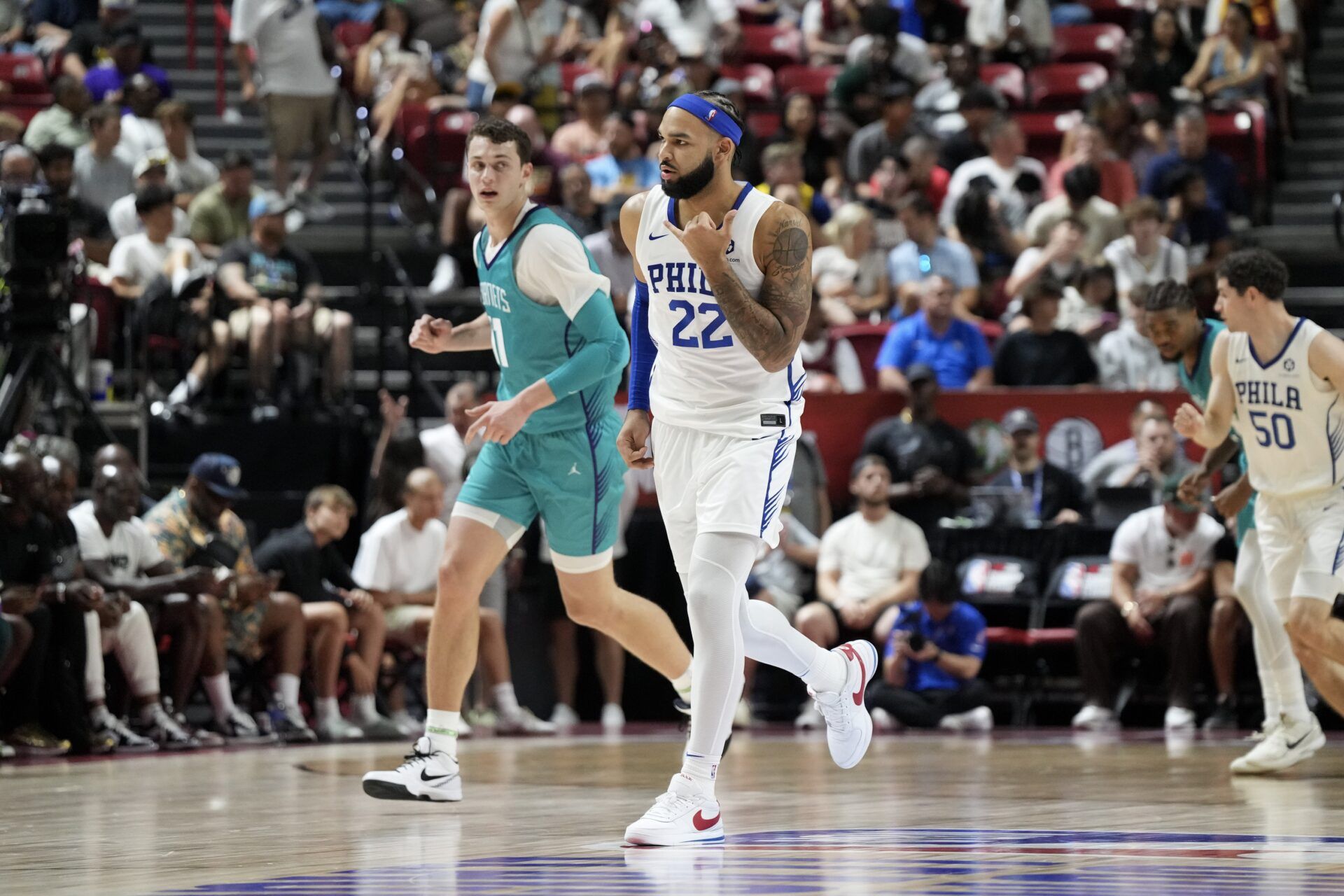 Philadelphia 76ers forward Johni Broome (22) reacts to hitting a 3-pointer against the Charlotte Hornets in the first quarter of their game at Thomas & Mack Center.
