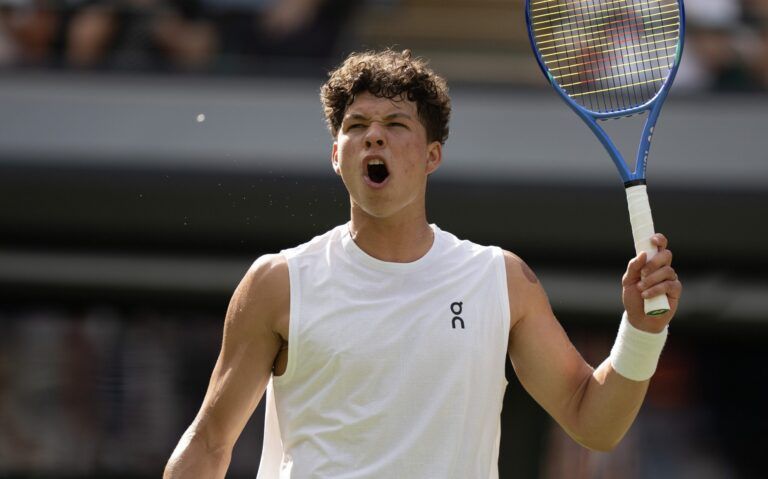 Ben Shelton of the United States reacts to a point during his match against Jannik Sinner of Italy on day 10 at All England Lawn Tennis and Croquet Club.