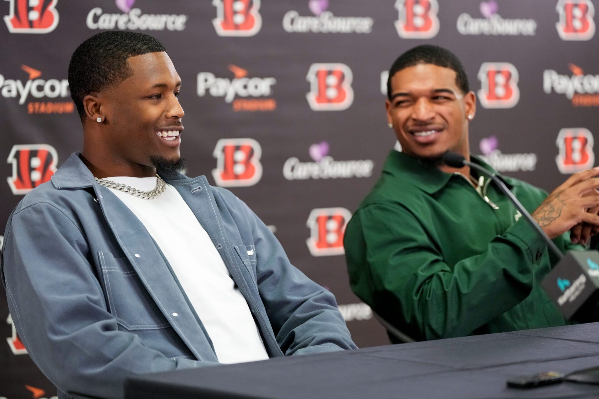 Ja’marr Chase reacts to Tee Higgins saying he plans to send his new money on an aquarium built into the wall of his home during a press conference to announce the signing of new contracts for Cincinnati Bengals wide receivers Ja’Marr Chase and Tee Higgins at Paycor Stadium in downtown Cincinnati on Tuesday, March 18, 2025. Chase becomes the new highest-paid non-quarterback player in the NFL. IMAGN