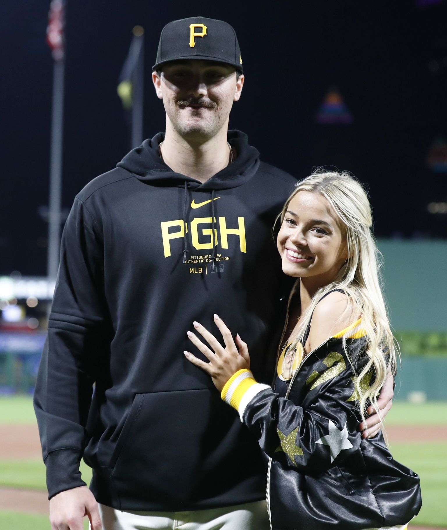 Pittsburgh Pirates starting pitcher Paul Skenes (30) poses with his girlfriend Louisiana State University gymnast Olivia Dunn (right) after making his major league debut against the Chicago Cubs at PNC Park. The Pirates won 10-8.