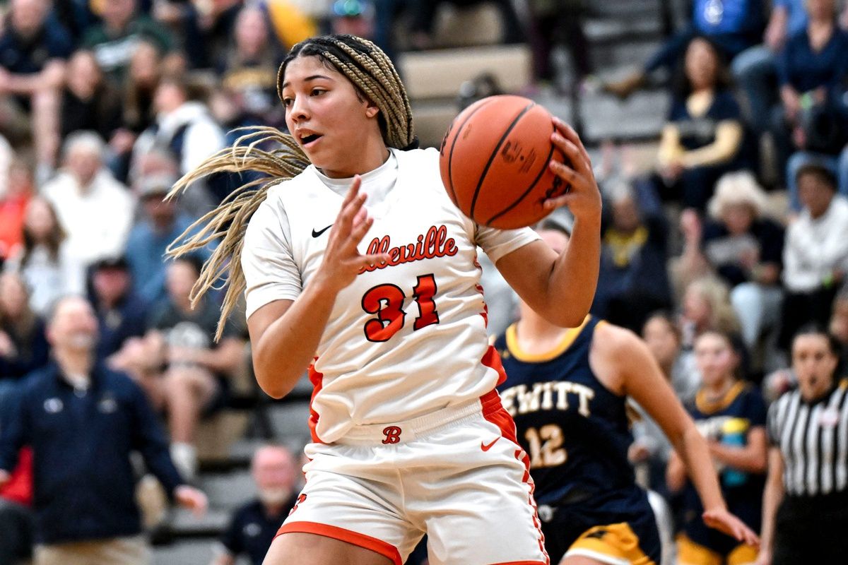 Belleville's Sydney Savoury grabs a rebound against DeWitt during the third quarter on Tuesday, March 18, 2025, in the D1 state quarterfinal at Holt High School.