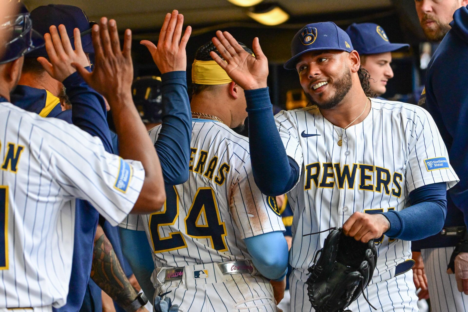 Milwaukee Brewers starting pitcher Freddy Peralta (51) is greeted in the dugout after pitching six plus innings against the Washington Nationals at American Family Field.