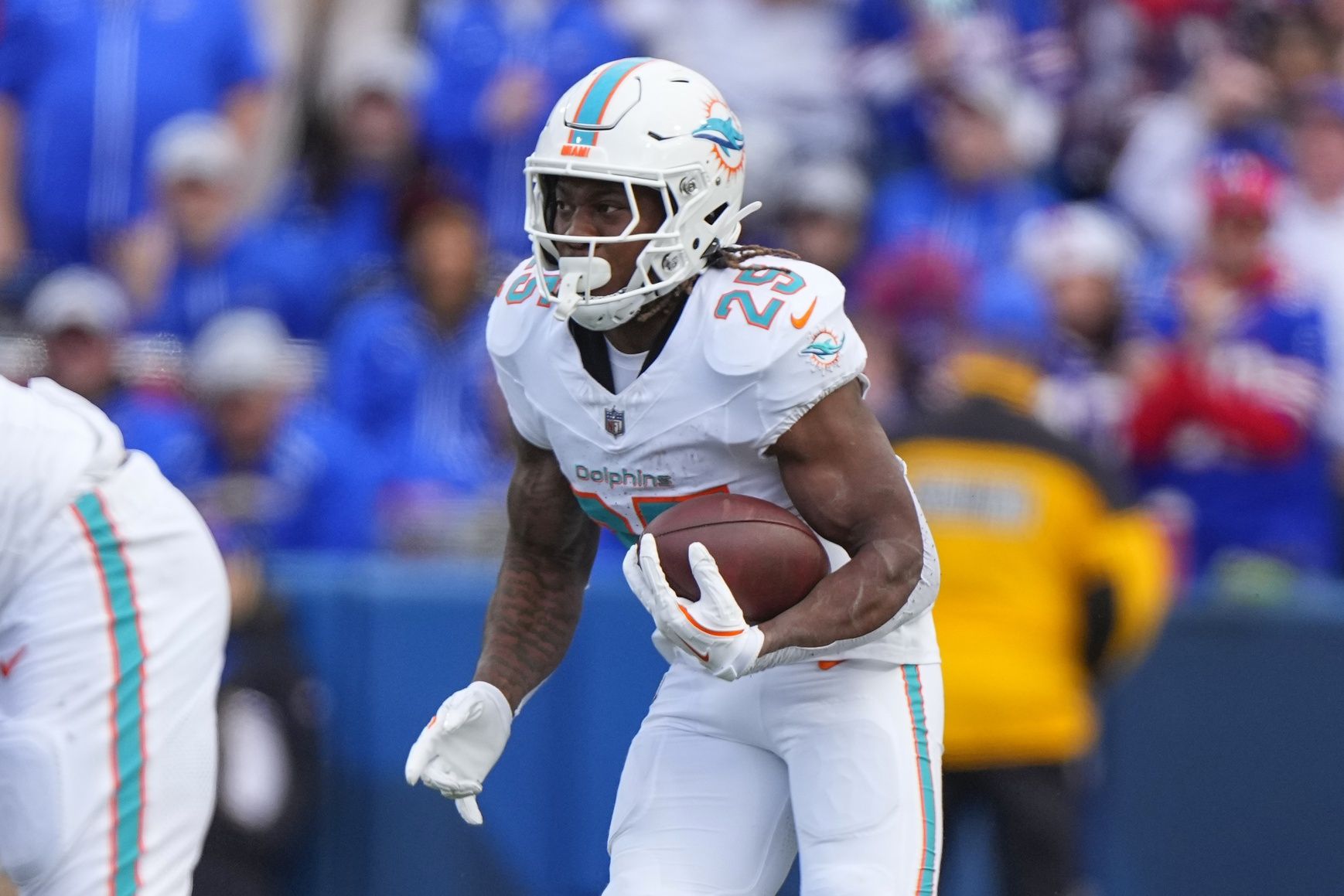 Miami Dolphins running back Jaylen Wright (25) runs with the ball against the Buffalo Bills during the second half at Highmark Stadium.