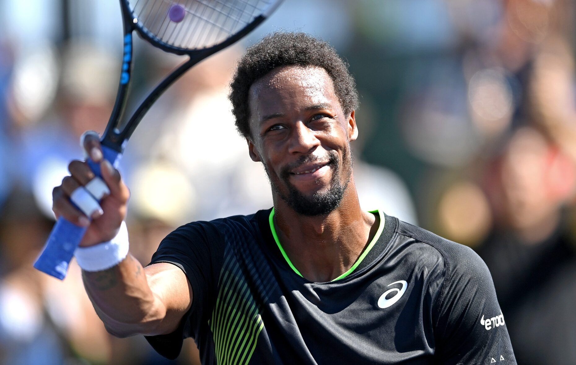 Gael Monfils (FRA) acknowledges the crowd after defeating Gianluca Mager (ITA) in his second round match during the BNP Paribas Open at the Indian Wells Tennis Garden.