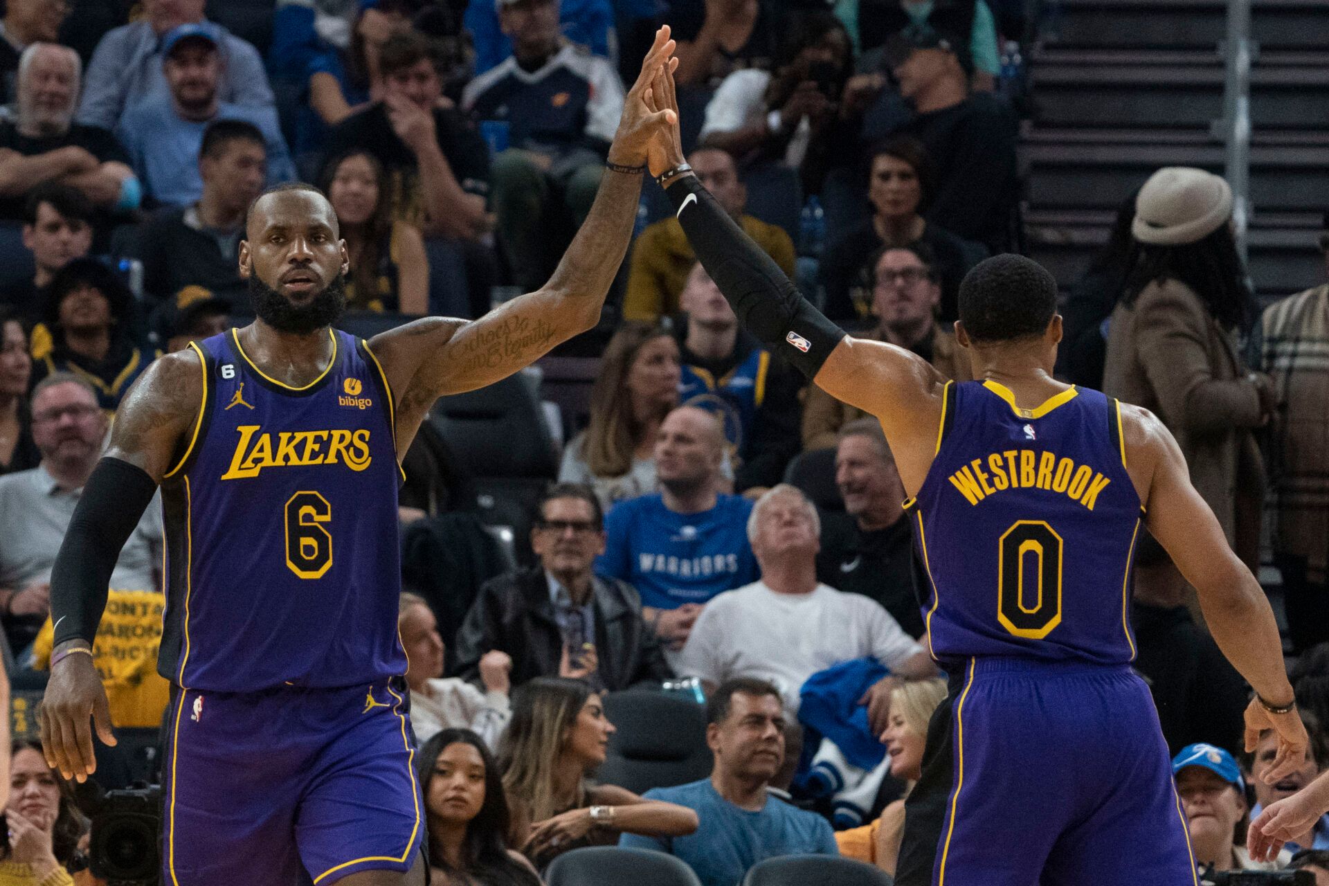 Los Angeles Lakers forward LeBron James (6) high-fives guard Russell Westbrook (0) during the second quarter against the Golden State Warriors at Chase Center.