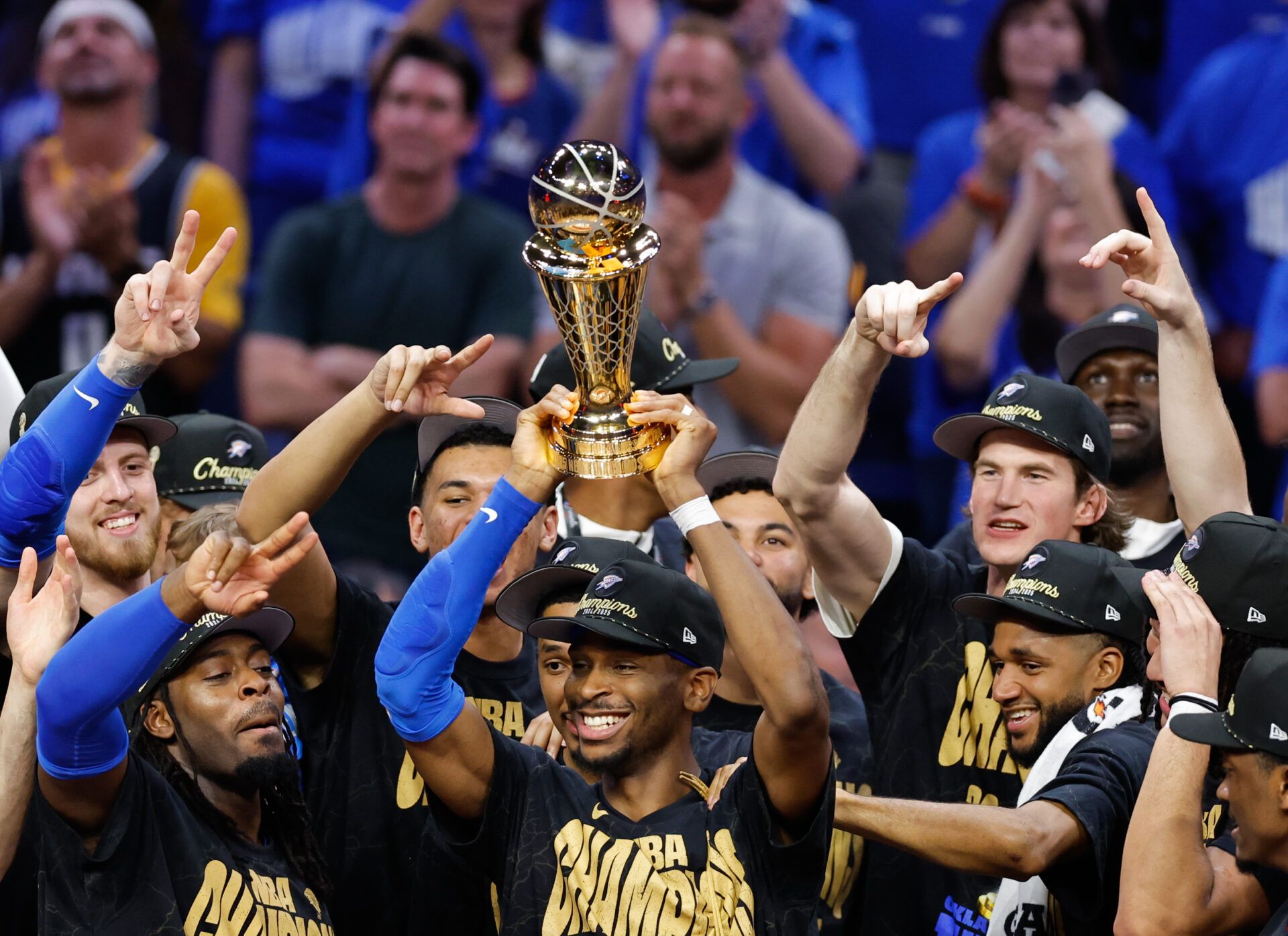 Oklahoma City Thunder guard Shai Gilgeous-Alexander (2) lifts the Larry O'Brien Championship Trophy as the Oklahoma City Thunder celebrate after winning game seven of the 2025 NBA Finals against the Indiana Pacers at Paycom Center.