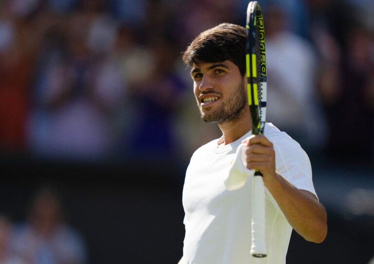 Carlos Alcaraz of Spain celebrates winning his match against Taylor Fritz of the United States on day 12 at All England Lawn Tennis and Croquet Club.