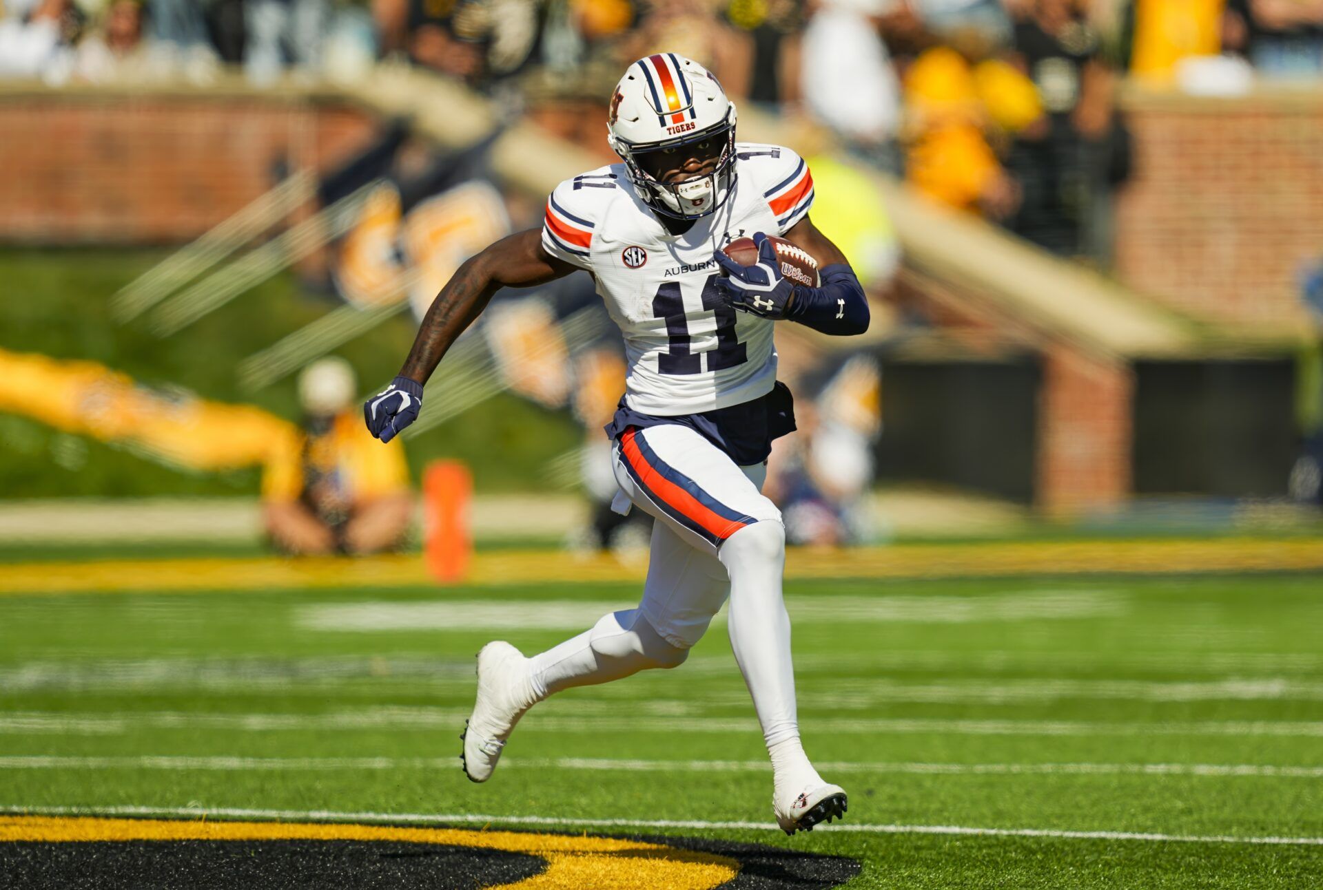 Auburn Tigers wide receiver Malcolm Simmons (11) runs with the ball during the first half against the Missouri Tigers at Faurot Field at Memorial Stadium.