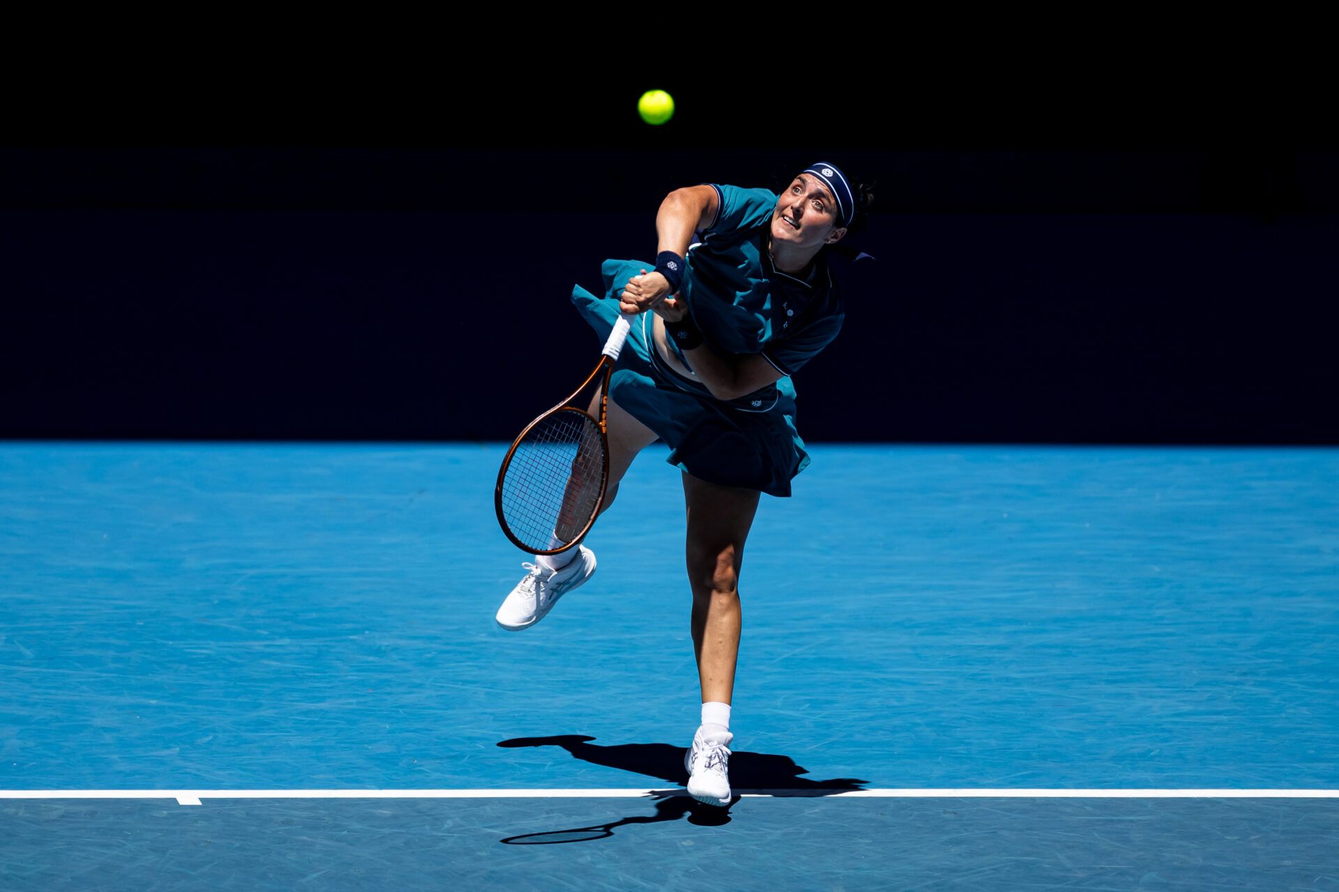 Ons Jabeur of Tunisia serves during her match against Emma Navarro of United States of America in the third round of the women's singles at the 2025 Australian Open at Melbourne Park.