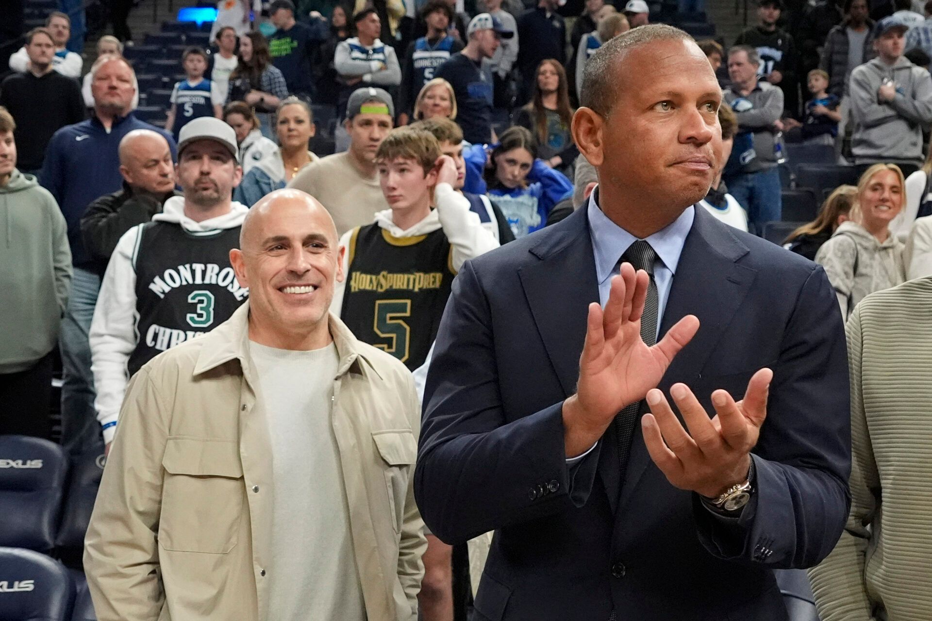 Minnesota Timberwolves minority owners Marc Lore and Alex Rodriguez celebrate the team's win over the Phoenix Suns at Target Center.
