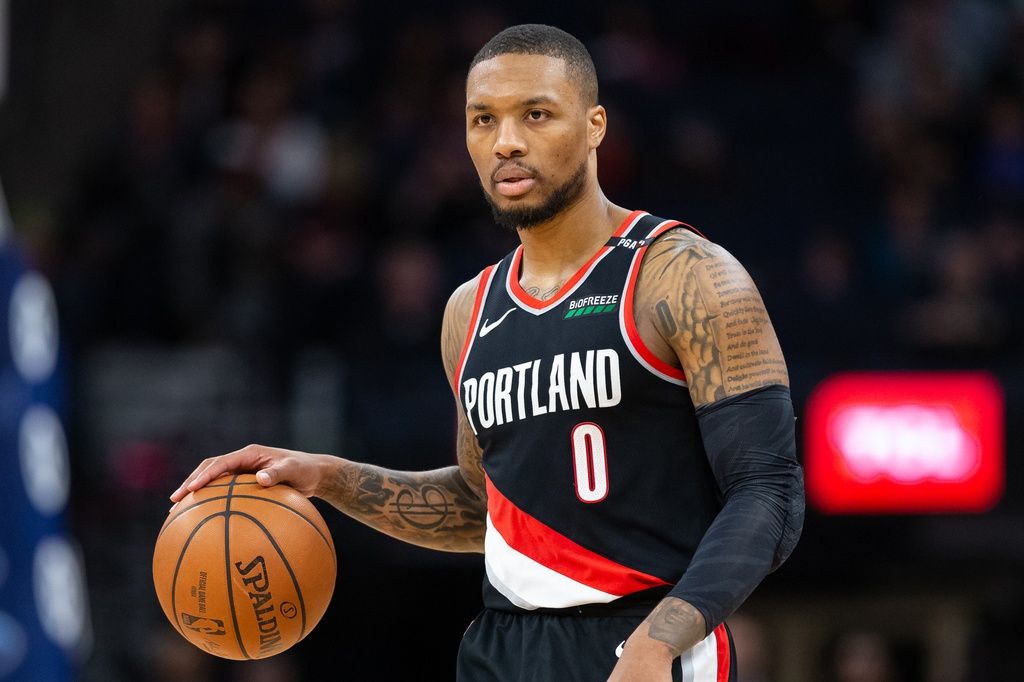 Portland Trail Blazers guard Damian Lillard (0) dribbles the ball during the third quarter against the Minnesota Timberwolves at Target Center.