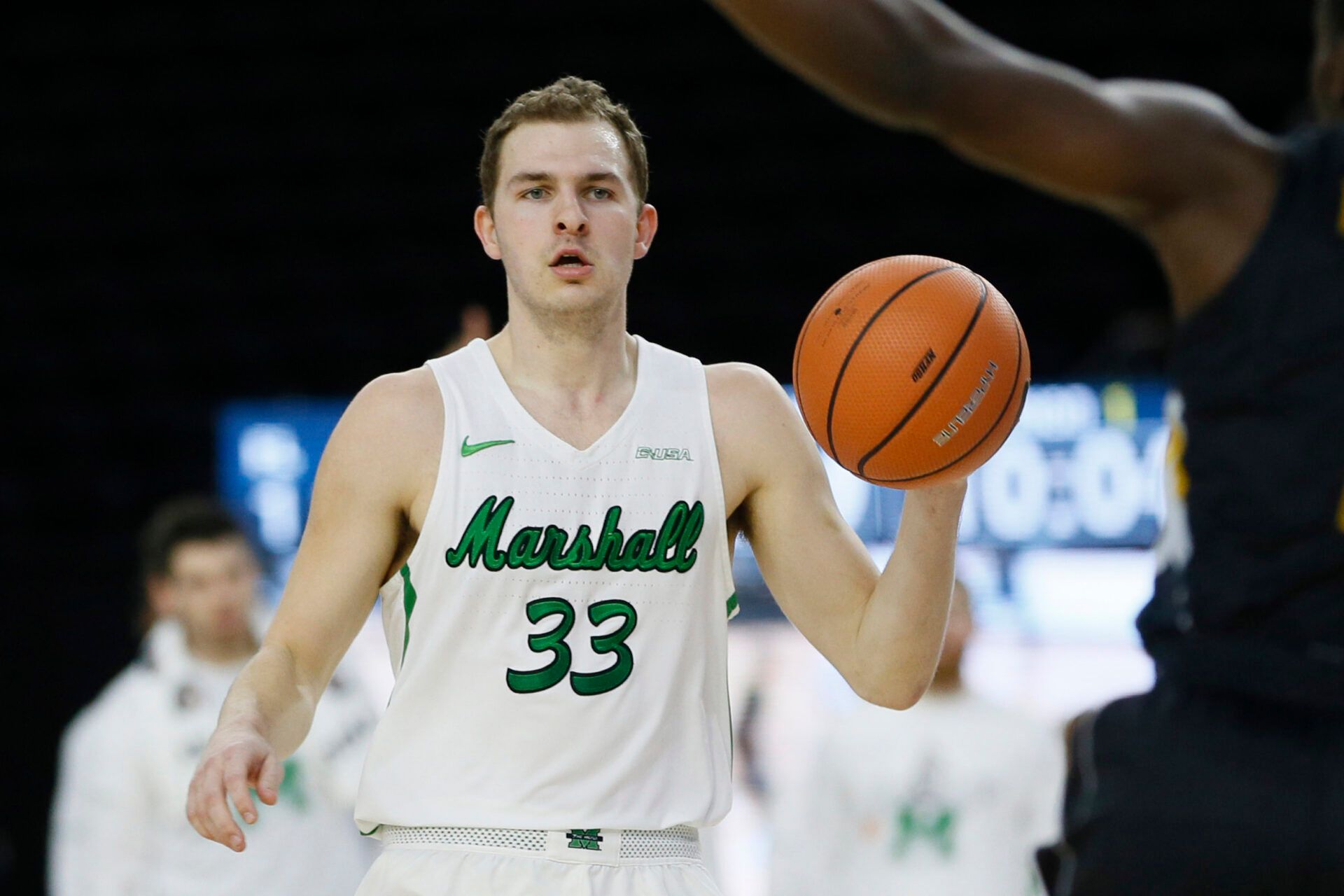 Marshall Thundering Herd guard Jon Elmore (33) dribbles up court during the first half against the Marshall Thundering Herd during the Conference USA Tournament at Ford Center at The Star.