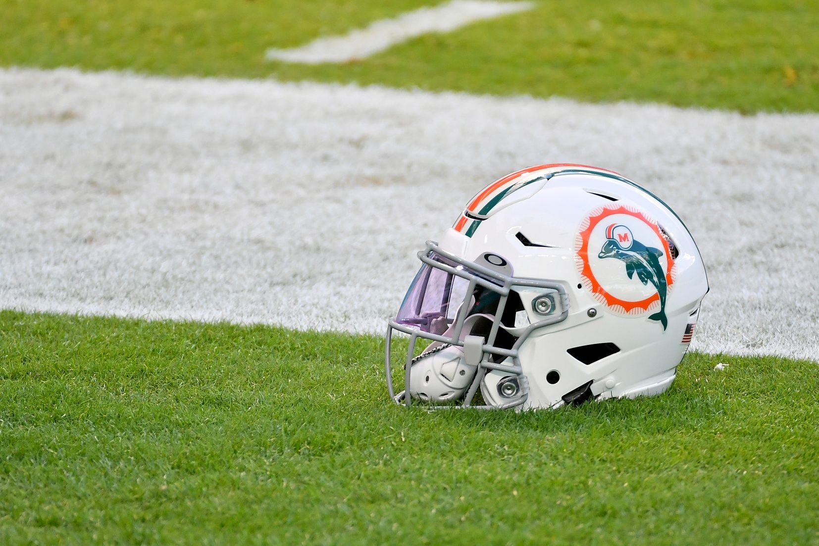 A general view of a Miami Dolphins helmet with the throwback logo sits on the field prior to the game between the Miami Dolphins and the Kansas City Chiefs at Hard Rock Stadium.