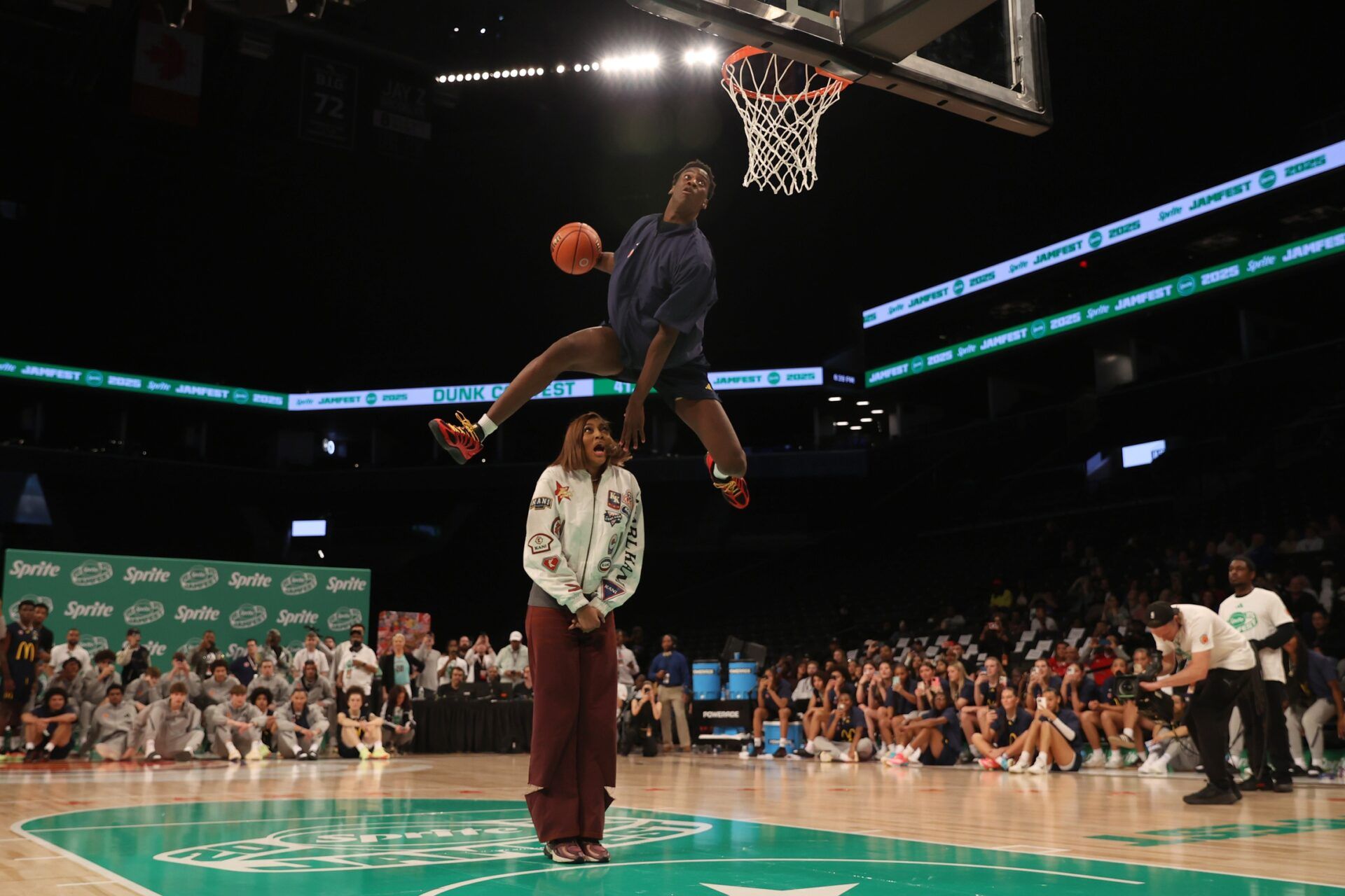 McDonald’s All American West forward AJ Dybantsa (3) dunks the ball over  Chicago Sky forward Angel Reese during the Sprite Jam Fest at Barclay's Center.