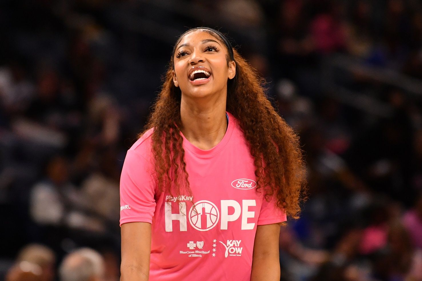 Chicago Sky forward Angel Reese (5) smiles during warm ups prior to the first half against the Dallas Wings at the Wintrust Arena.
