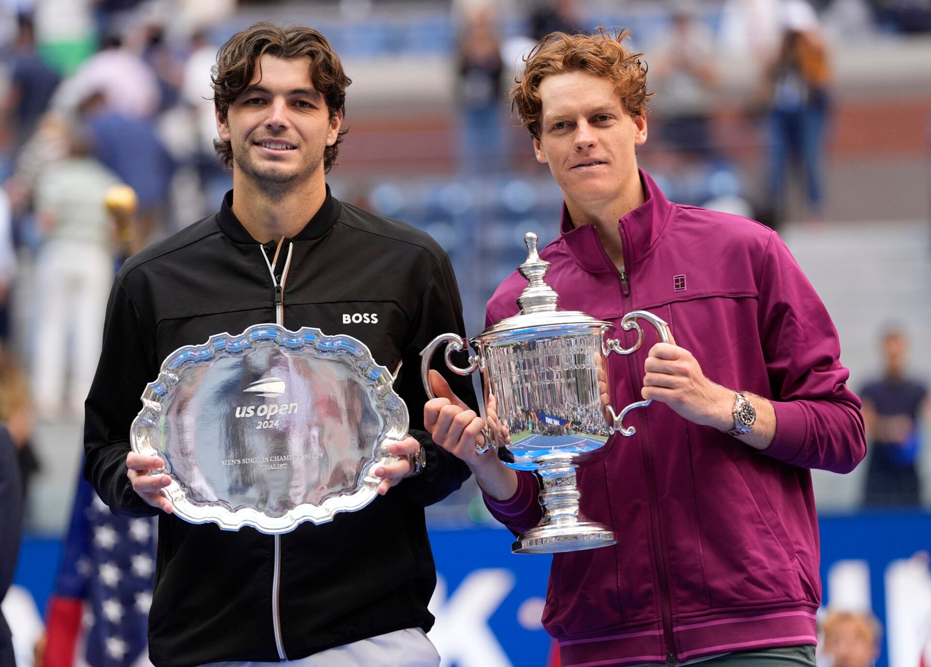 Jannik Sinner (ITA) and Taylor Fritz (USA) pose for a photo with trophies after the men’s singles final of the 2024 U.S. Open tennis tournament at USTA Billie Jean King National Tennis Center.