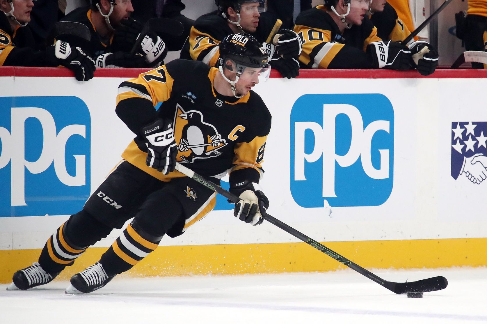 Pittsburgh Penguins center Sidney Crosby (87) skates with the puck against the Ottawa Senators during the first period at PPG Paints Arena.