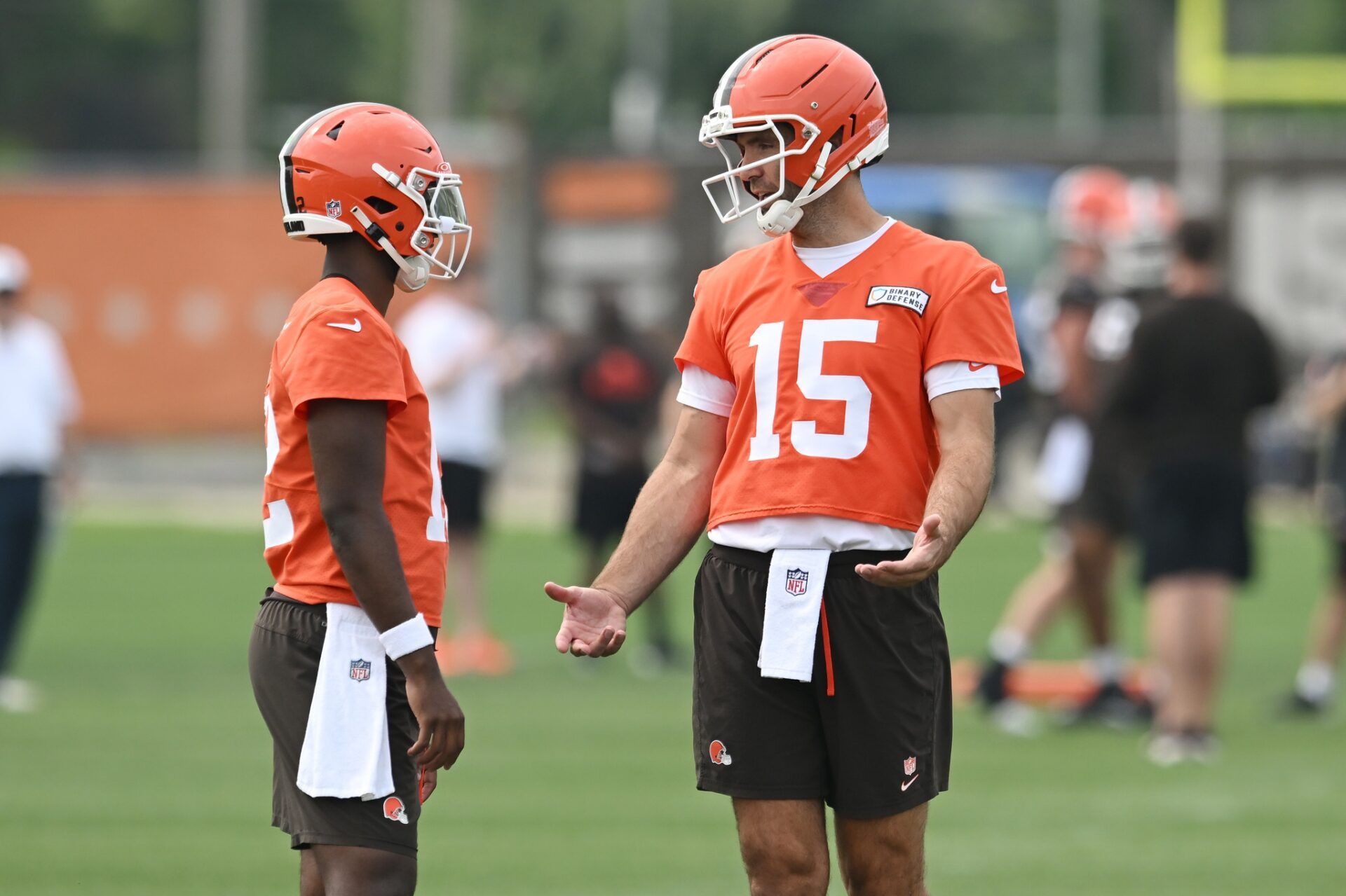 Cleveland Browns quarterback Joe Flacco (15) talks to quarterback Shedeur Sanders (12) during mini camp at CrossCountry Mortgage Campus.