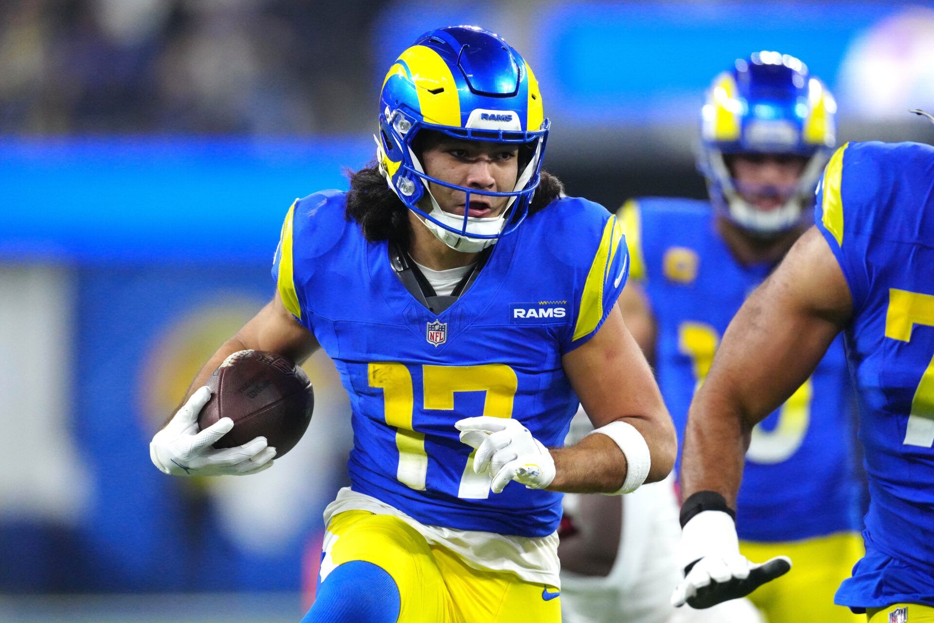 Los Angeles Rams wide receiver Puka Nacua (17) carries the ball against the Arizona Cardinals in the second half at SoFi Stadium.