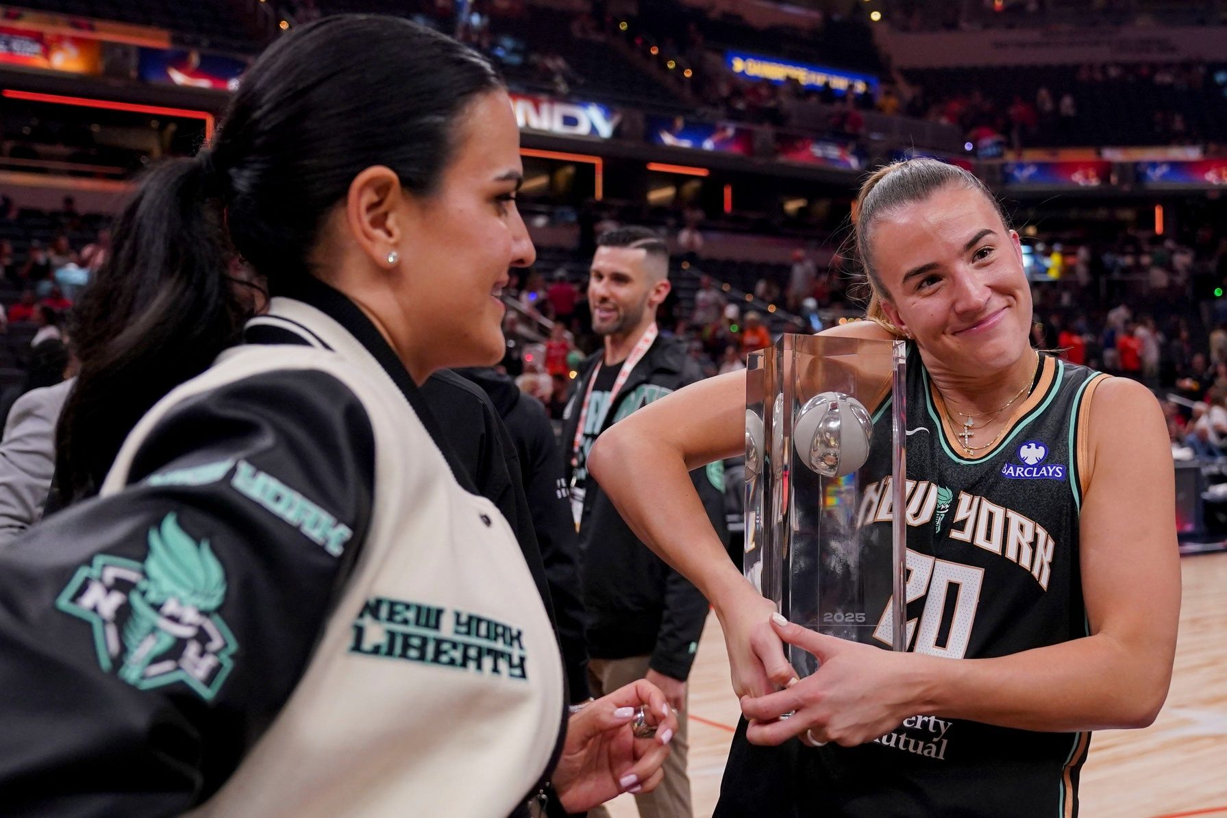 New York Liberty's Sabrina Ionescu (20) holds her trophy Friday, July 18, 2025, after winning the WNBA All-Star 3-point contest at Gainbridge Fieldhouse in Indianapolis.