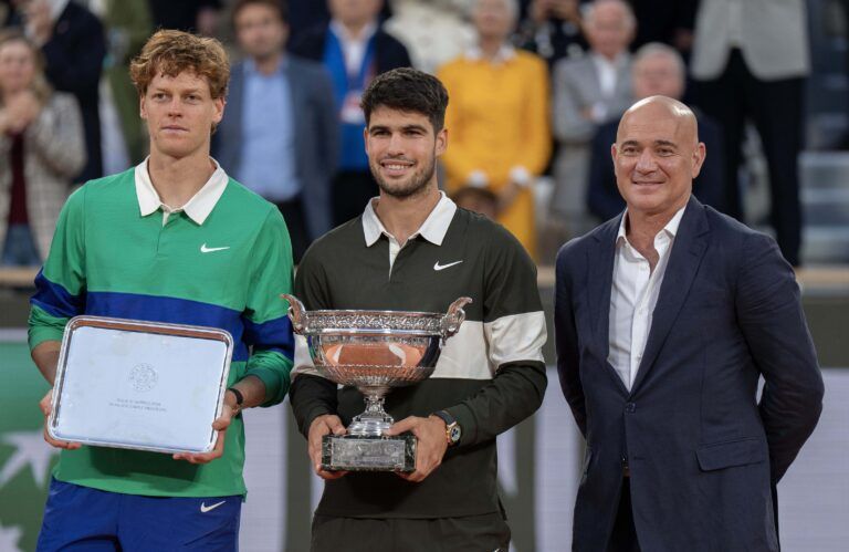 Andre Agassi, Jannik Sinner of Italy and Carlos Alcaraz of Spain pose together at the trophy presentation after the men’s singles final on day 15 at Roland Garros Stadium.