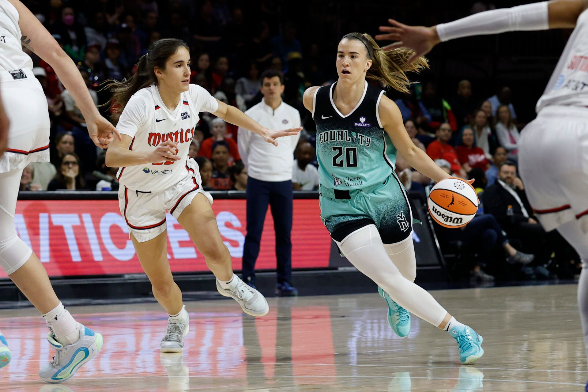 New York Liberty guard Sabrina Ionescu (20) drives to the basket as Washington Mystics guard Sonia Citron (22) defends in the first half at CareFirst Arena.