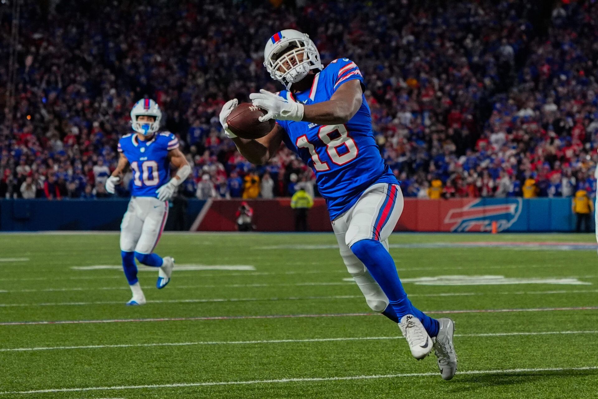 Buffalo Bills wide receiver Amari Cooper (18) makes a catch against the Kansas City Chiefs during the first half at Highmark Stadium.