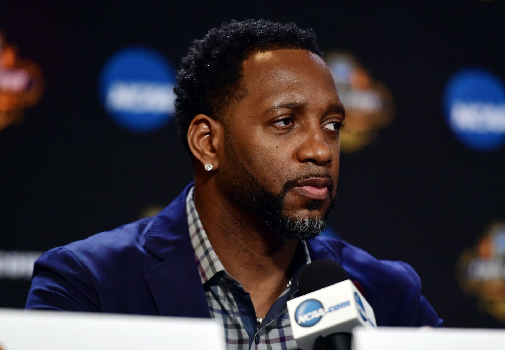 NBA former play Tracy McGrady is interviewed during the Naismith Hall of Game Press Conference at University of Phoenix Stadium.